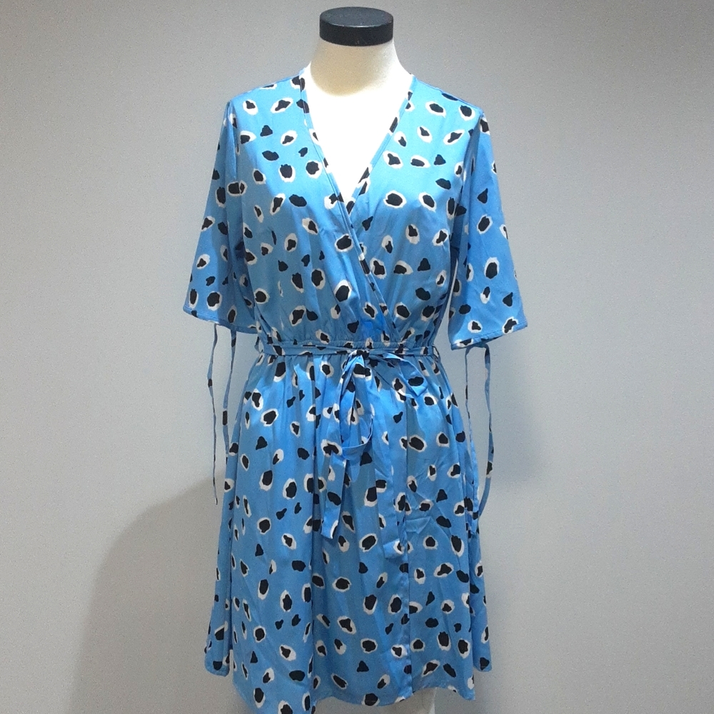 Blue wrap dress with black and white details